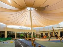 Outdoor play area with big shade sail