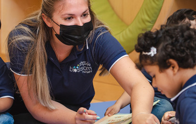 Teacher interacting with children