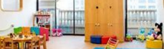 Nursery classroom with timber table and floor mats