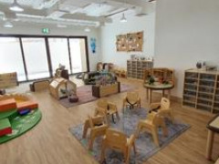 Nursery classroom with chairs toys and floor mats