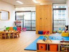 Nursery classroom with timber table and floor mats