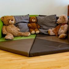 Teddy bears sitting on floor mats
